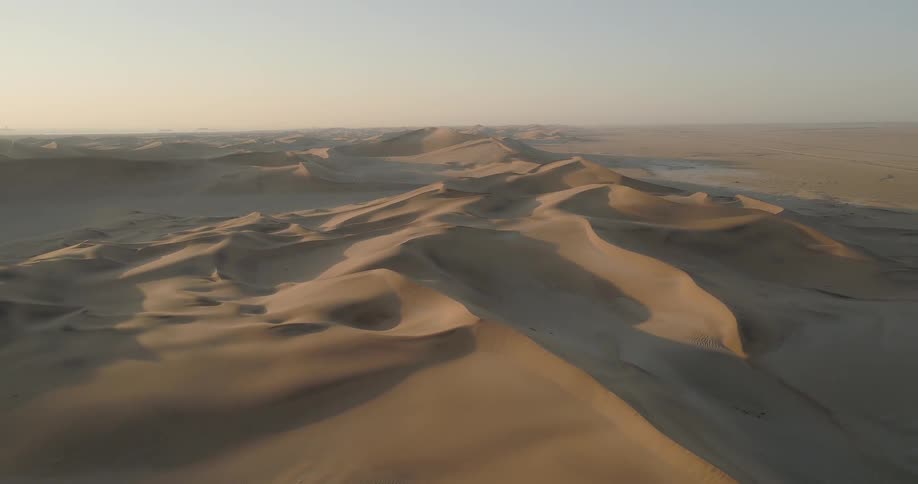 Sand dunes stretched across a large desert