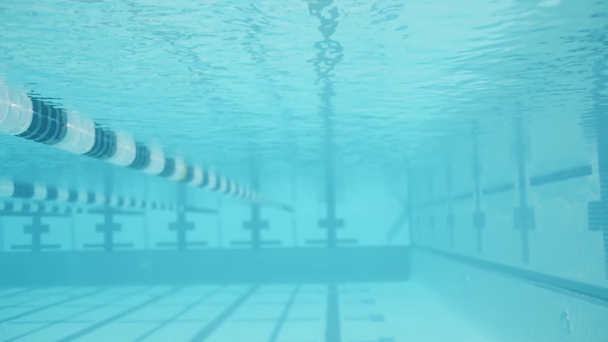 Ripples form above underwater view of swim lane