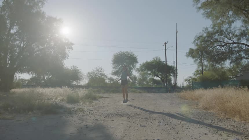 A woman jumps rope outdoors