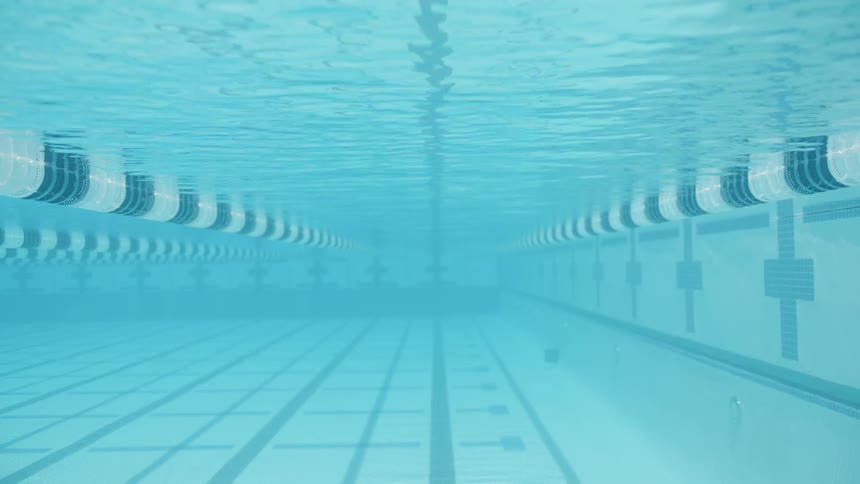 Underneath the water in an olympic size pool