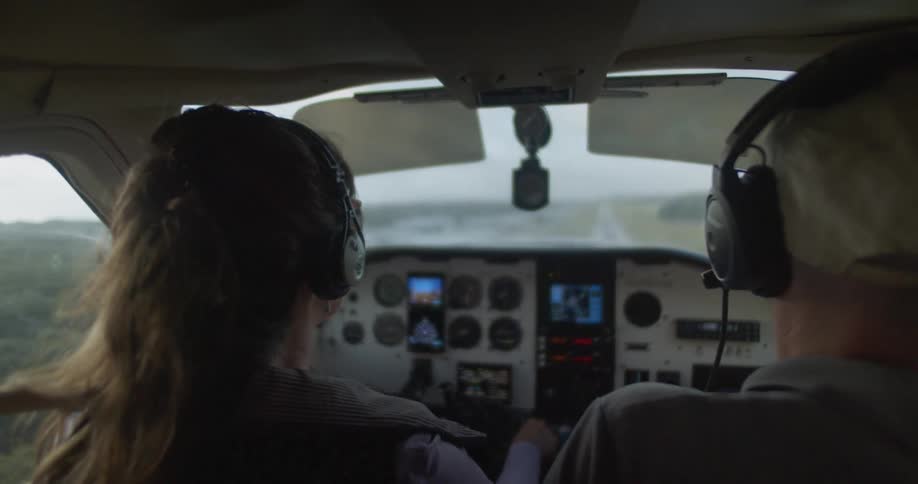 A pilot and passenger fly a small airplane