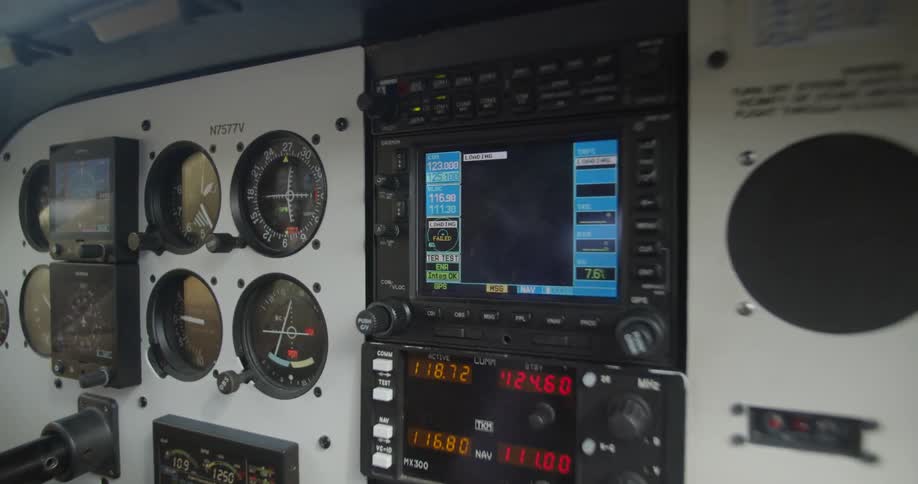 Various flight instruments and buttons make up the instrument panel of an aircraft