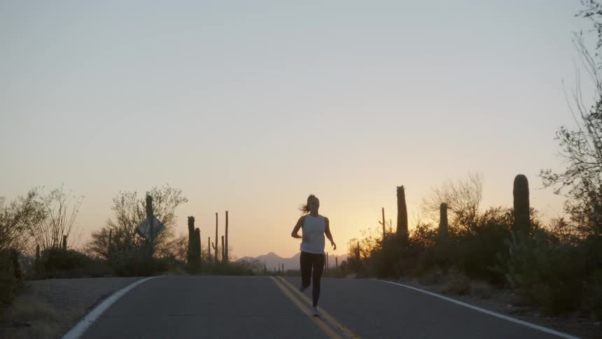 A woman runs on the road