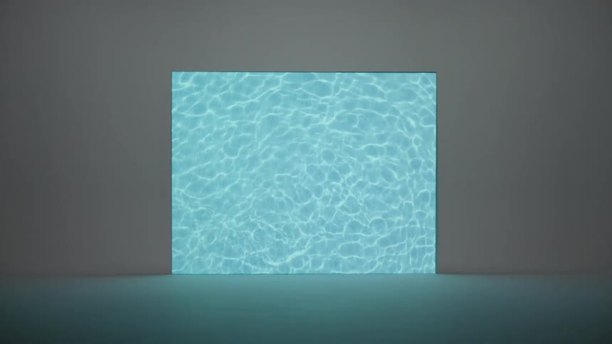 An image of light refracting off of the ripples in a body of clear water is projected onto a plain wall