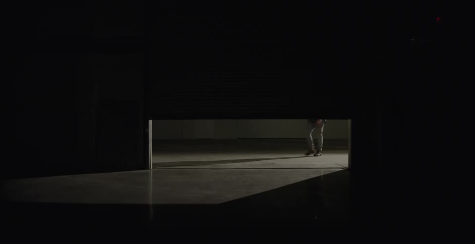 A man is walking into a room