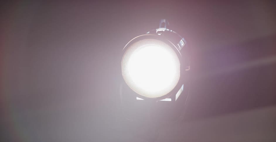 A light turning on that is on a pole