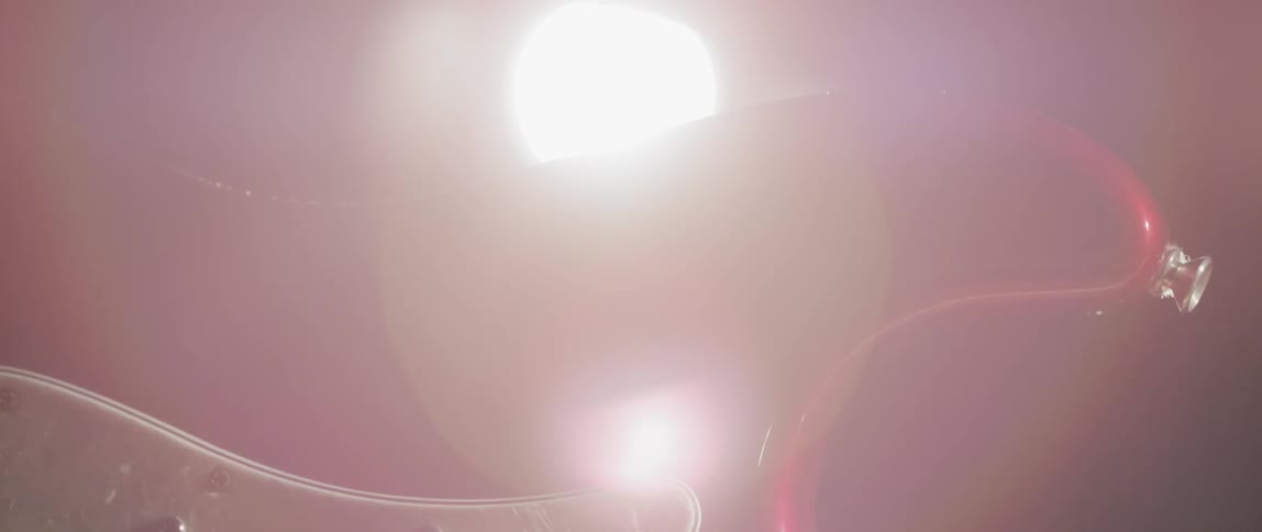 Close up view of a metal object with a bright light behind it