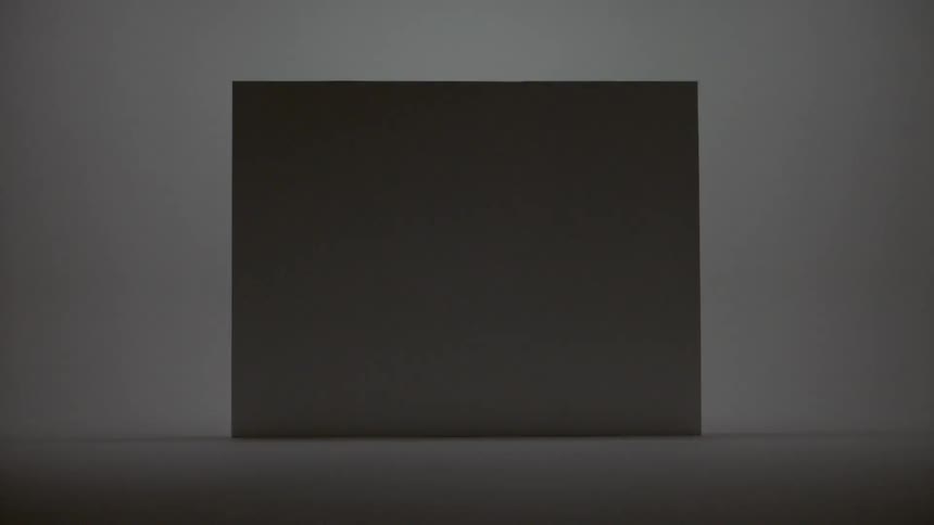 A gray rectangle against a white wall