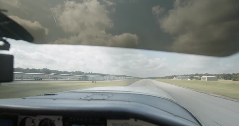 An aircraft is driving down a runway