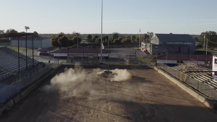 A car is spinning in circles outdoors