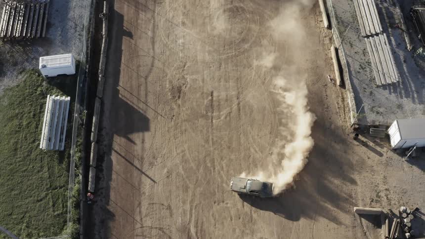 A car is driving in a rural area