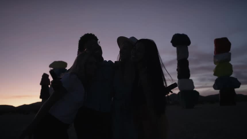 Silhouettes of people at dusk