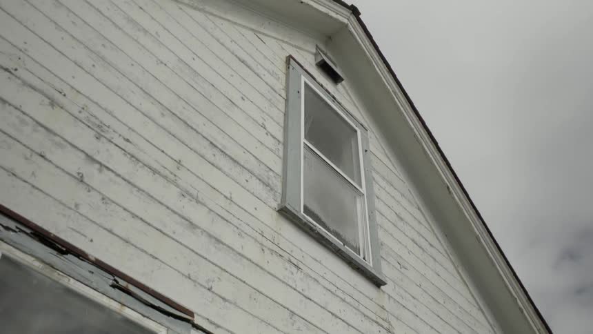 View of a the side of a house on a cloudy day