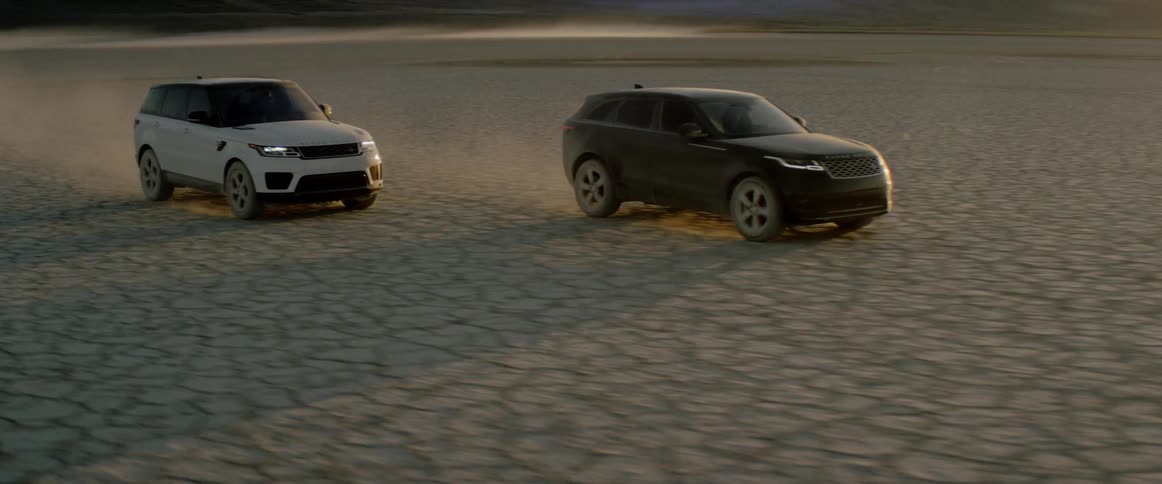 Cars are driving in a desert area