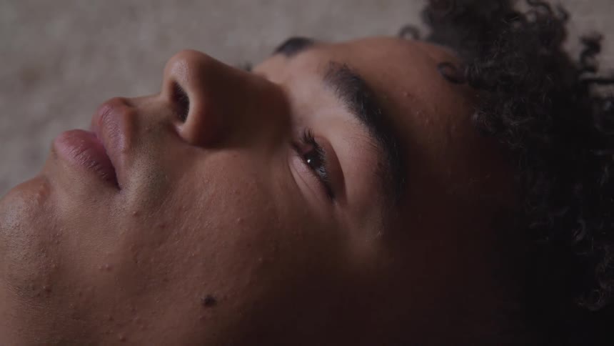A woman opening her eyes