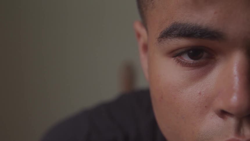 A man opens his eye and look straight ahead