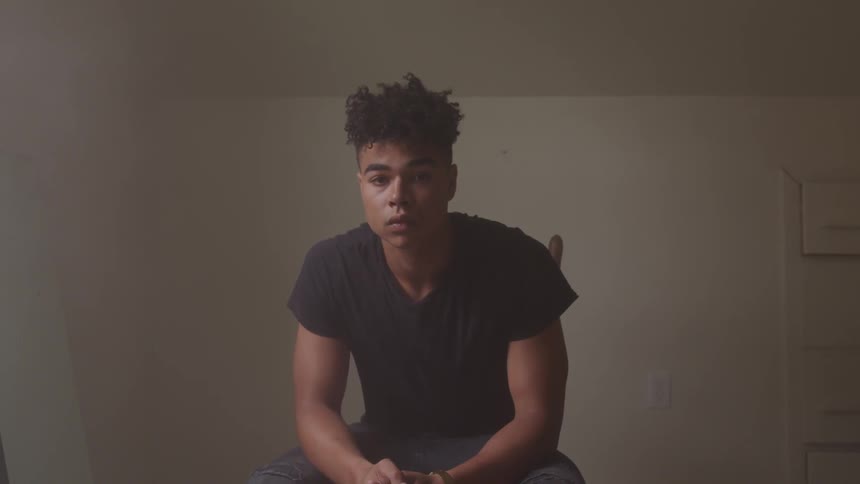 A man that is sitting in a room