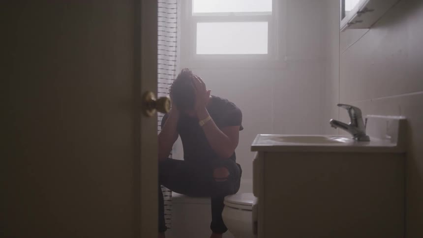 A man sits on the tub