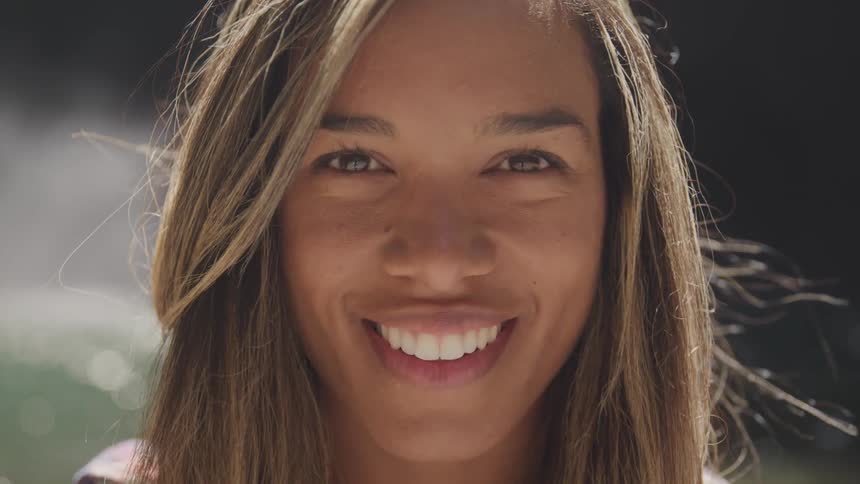 Close up of blonde woman smiling with very white teeth
