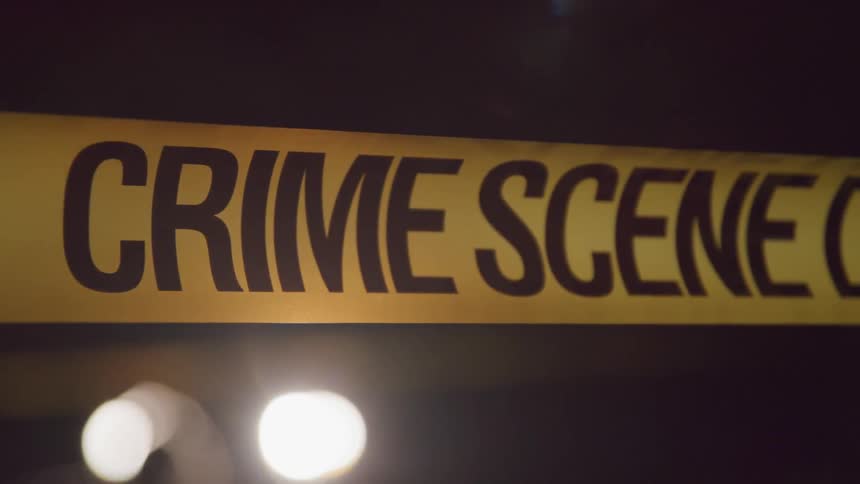 Close up of crime scene tape at night