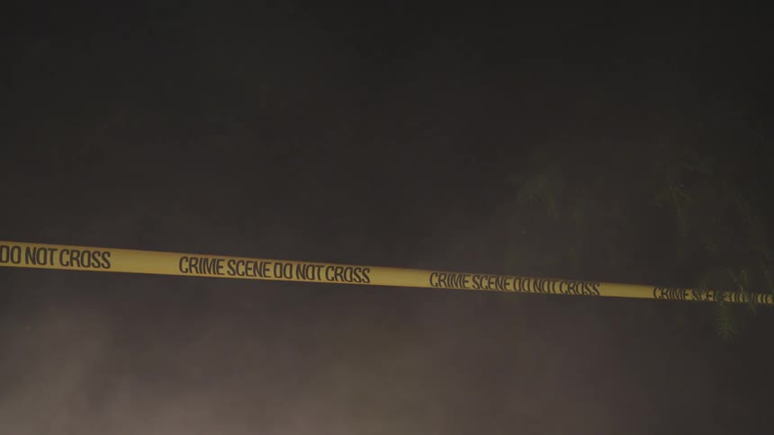 Crime scene tape cordons off an area