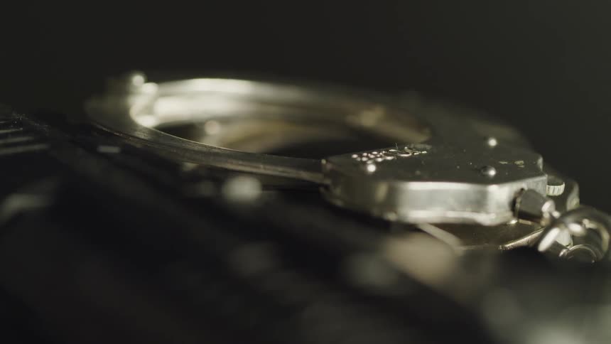 A pair of metal handcuffs