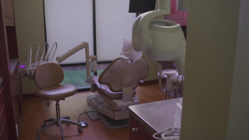 View of modern empty dentist office with dental operatory equipment
