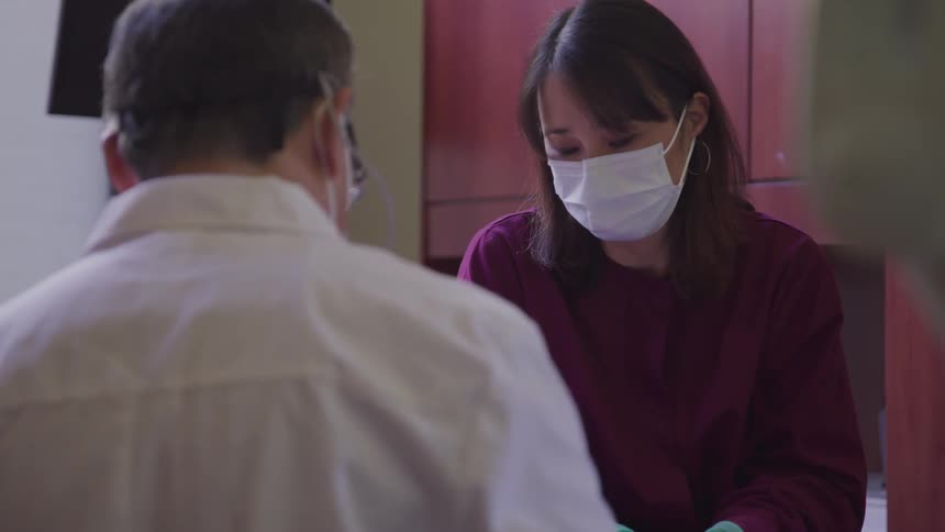 A patient checking his condition to a doctor