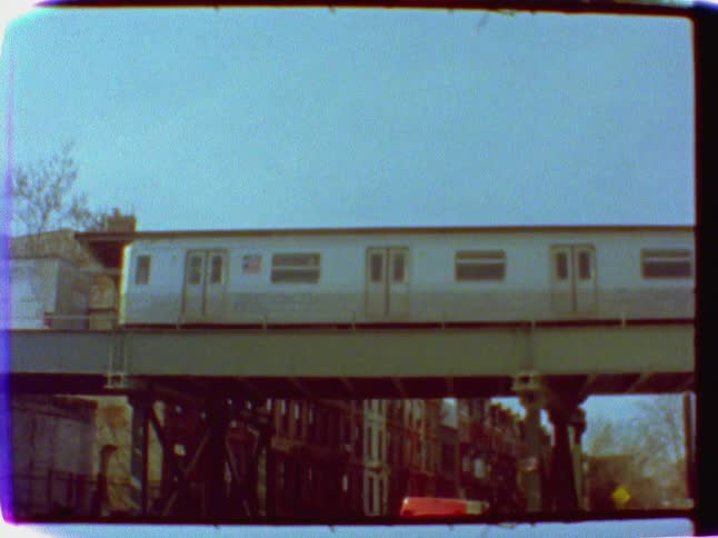 A train crosses a bridge in a city