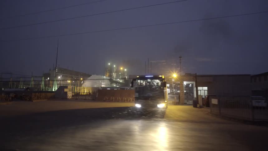 Driving past an industrial building in the snow
