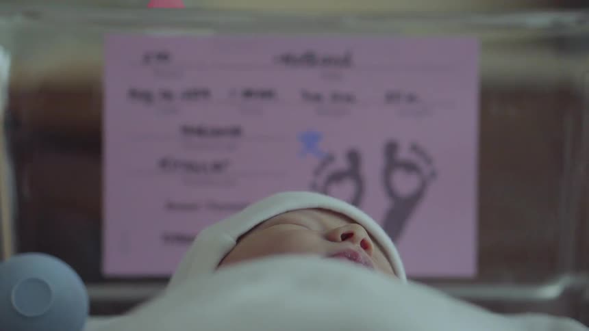 A toddler sleeping at the hospital room