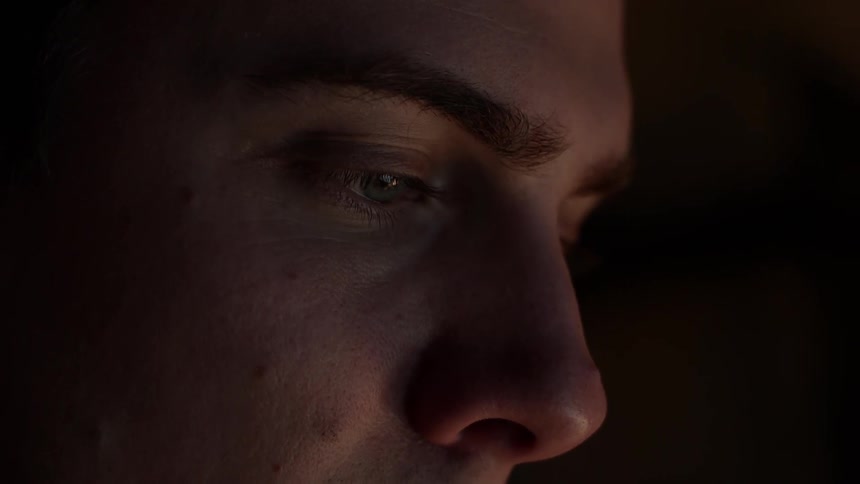 A man stares at something off screen