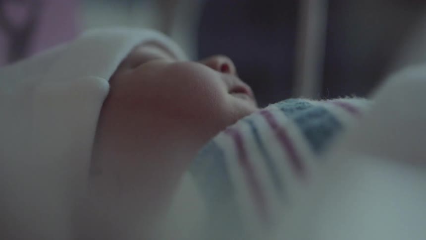A newborn sleeps soundly