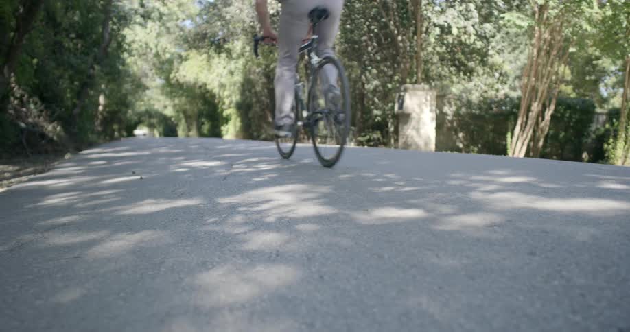 A man riding a bike in a park
