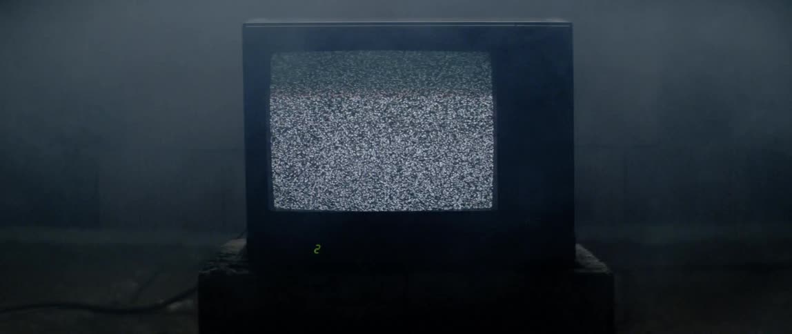 A broken tv displaying noises