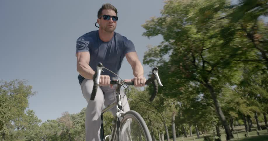 A young man rides his bike