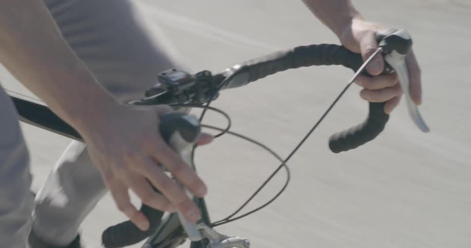 A man bikes quickly