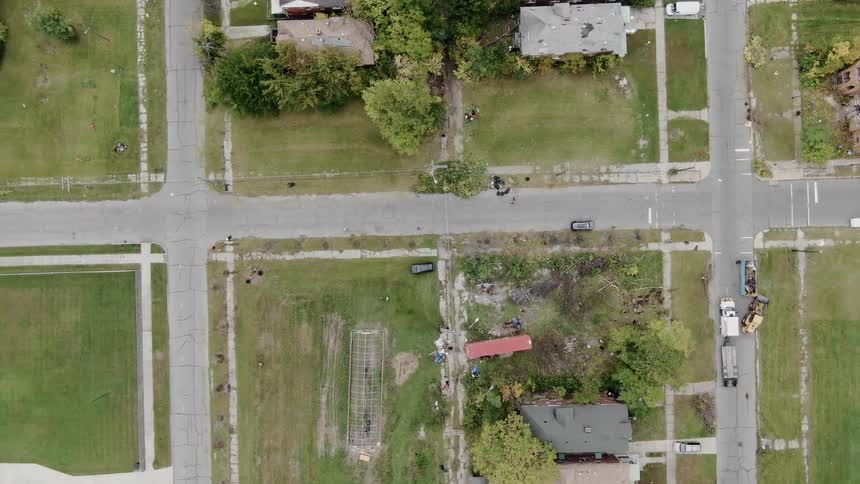 A person walks down a neighborhood street
