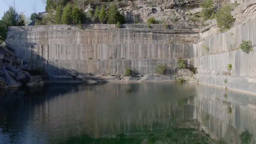 A cliff is near the coast of a body of water