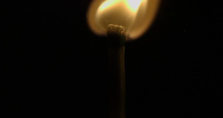 Close up of a burning match