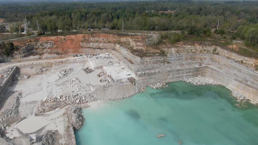 Landscape view of a body of water surrounded by a cement wall
