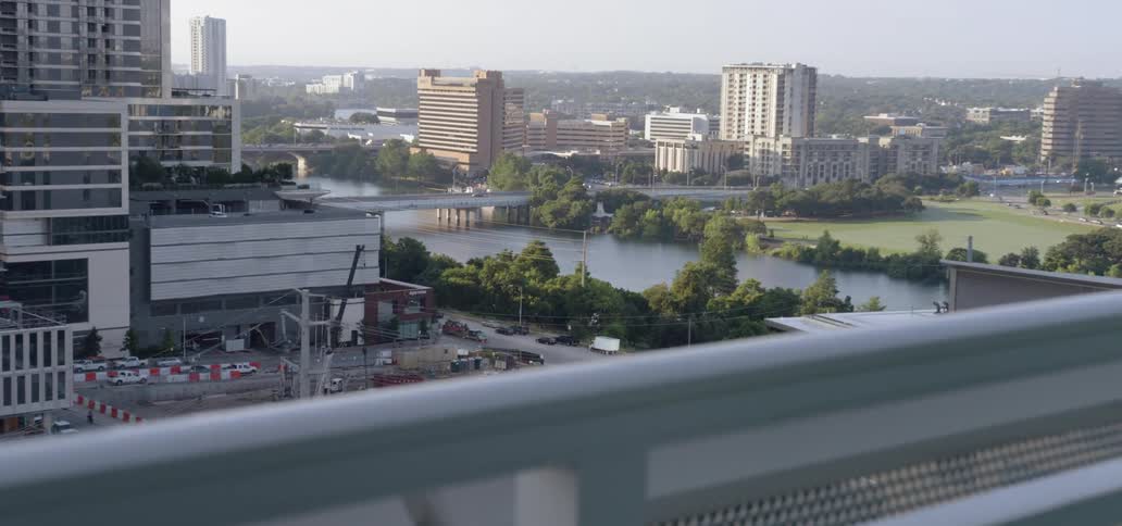 A river runs through a city and is lined by a number of tall buildings