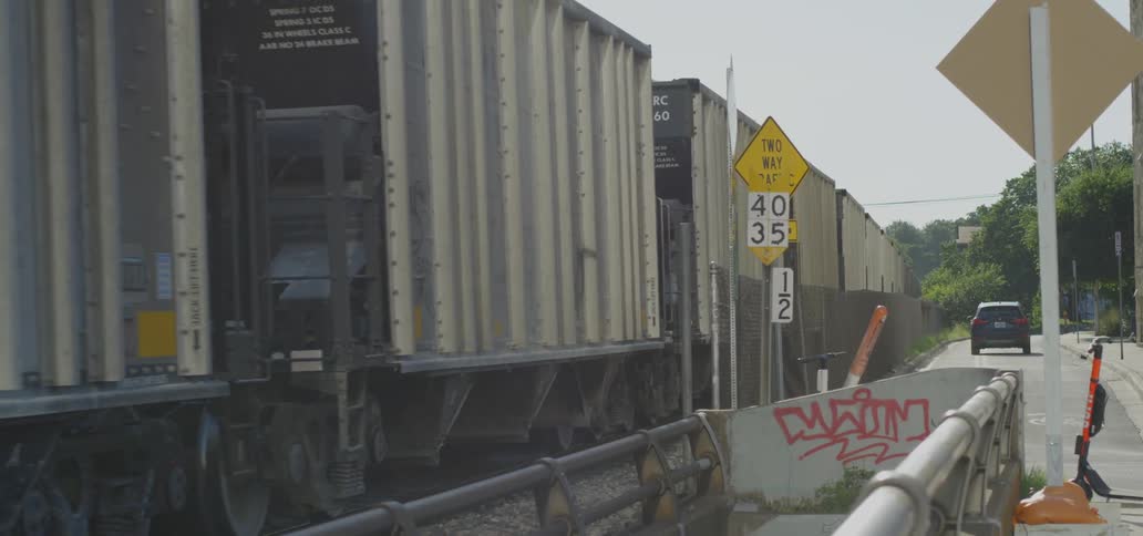 A footage of a cargo train near the road