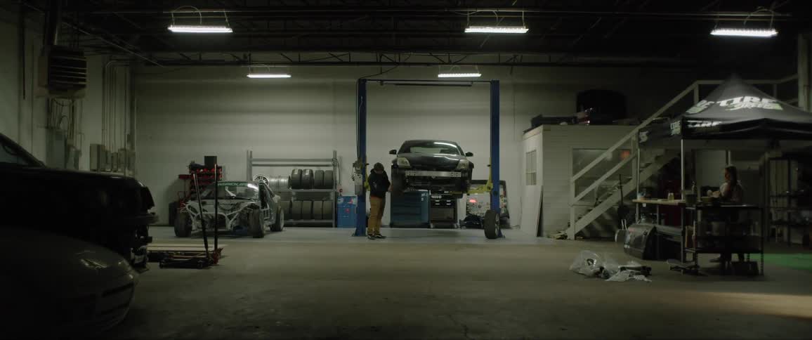 People work in an auto shop