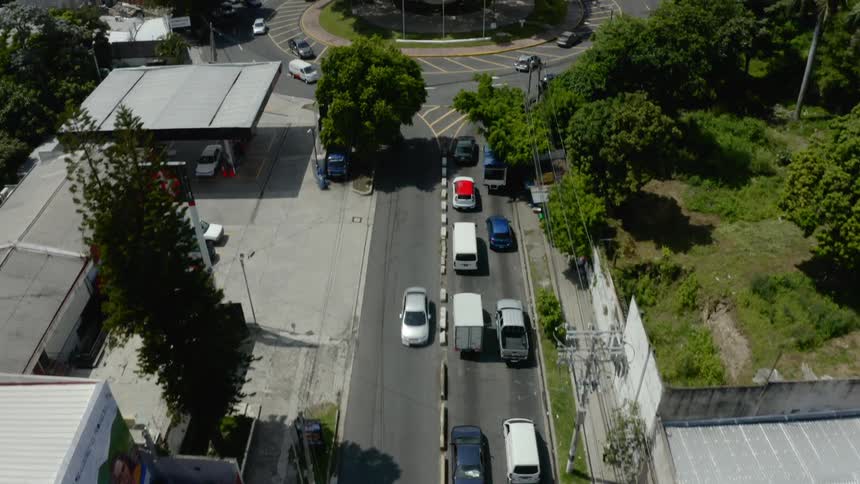 Aerial view of cars driving down a road