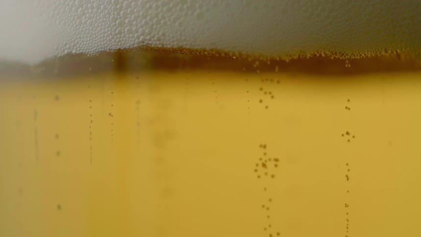 Beer frothing in a glass