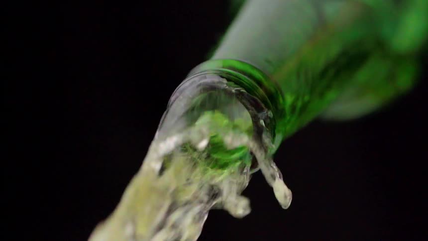 Beer flows from a bottle