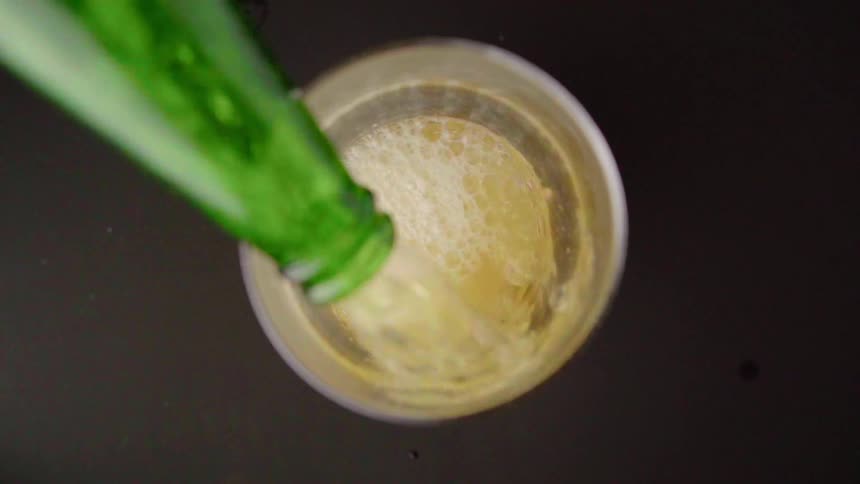 Beer is being poured into a glass