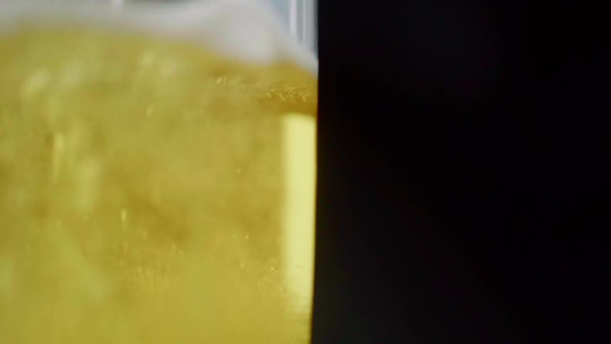 Beer is filling the glass