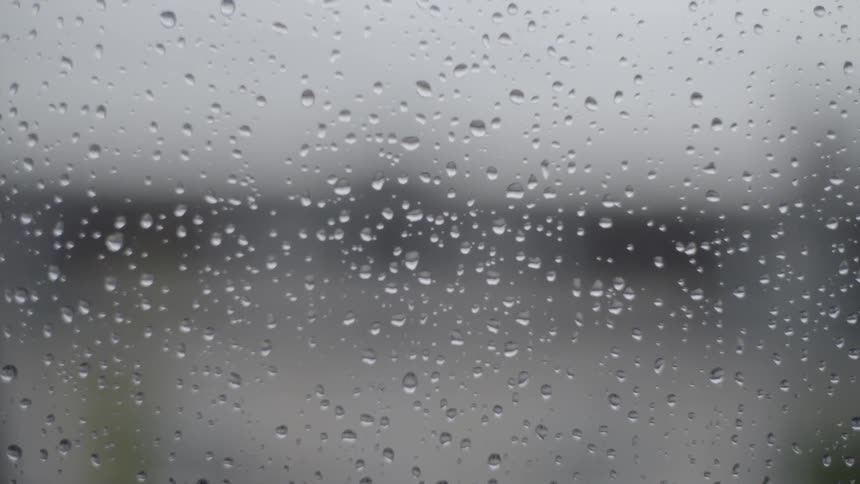 View of droplets on the glass in the cloudy weather